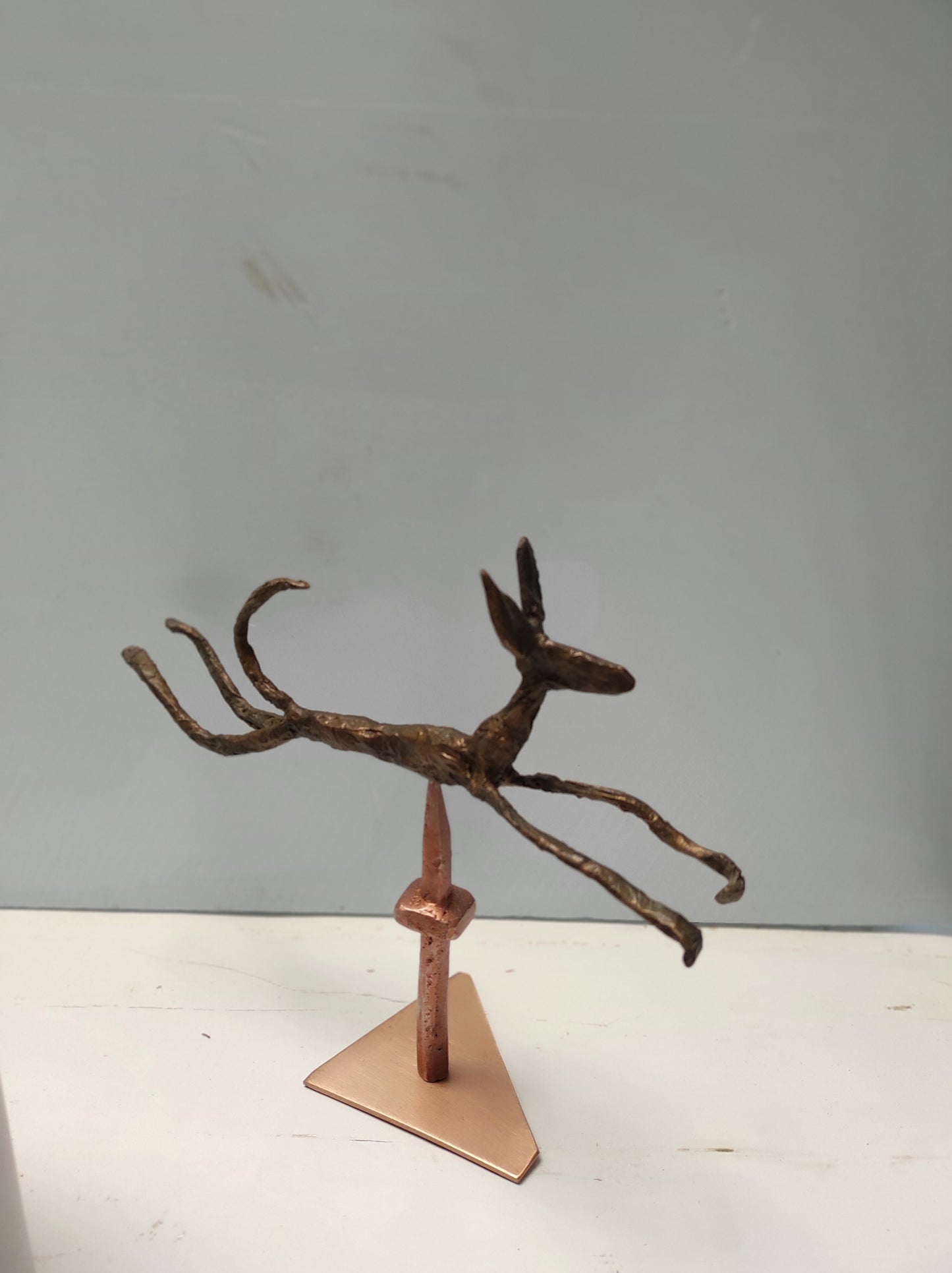 Leaping bronze Podenco on tang